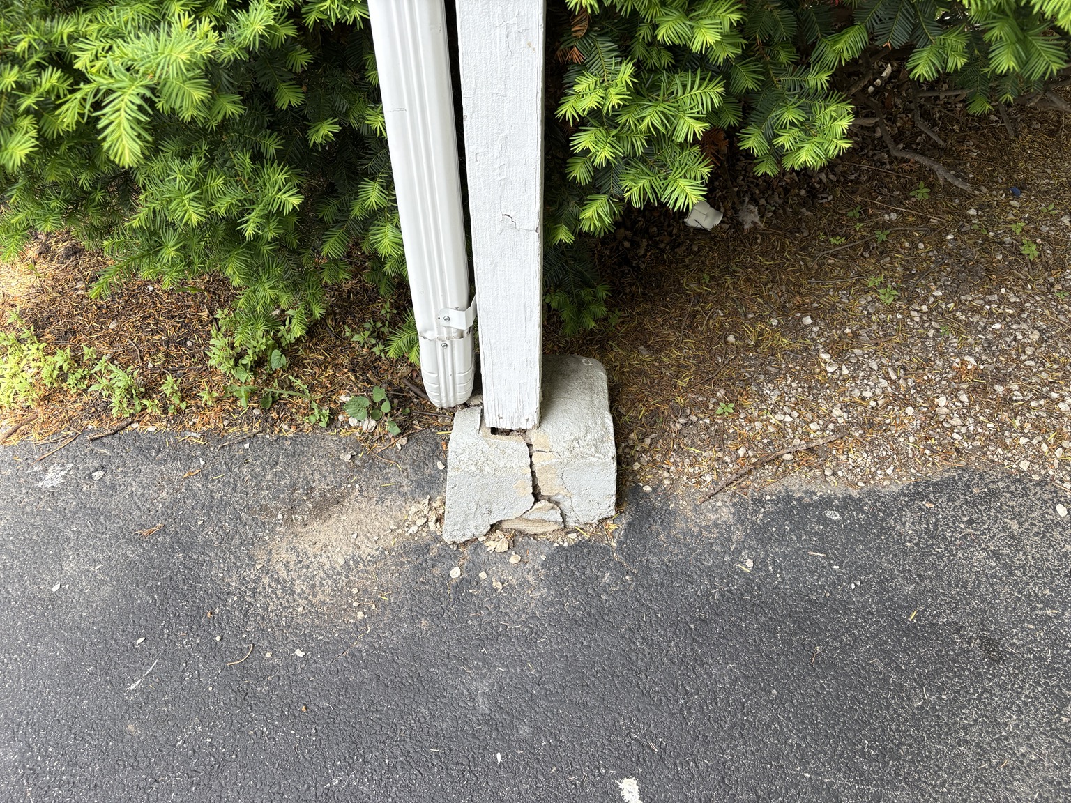 Cracked exterior support post base example